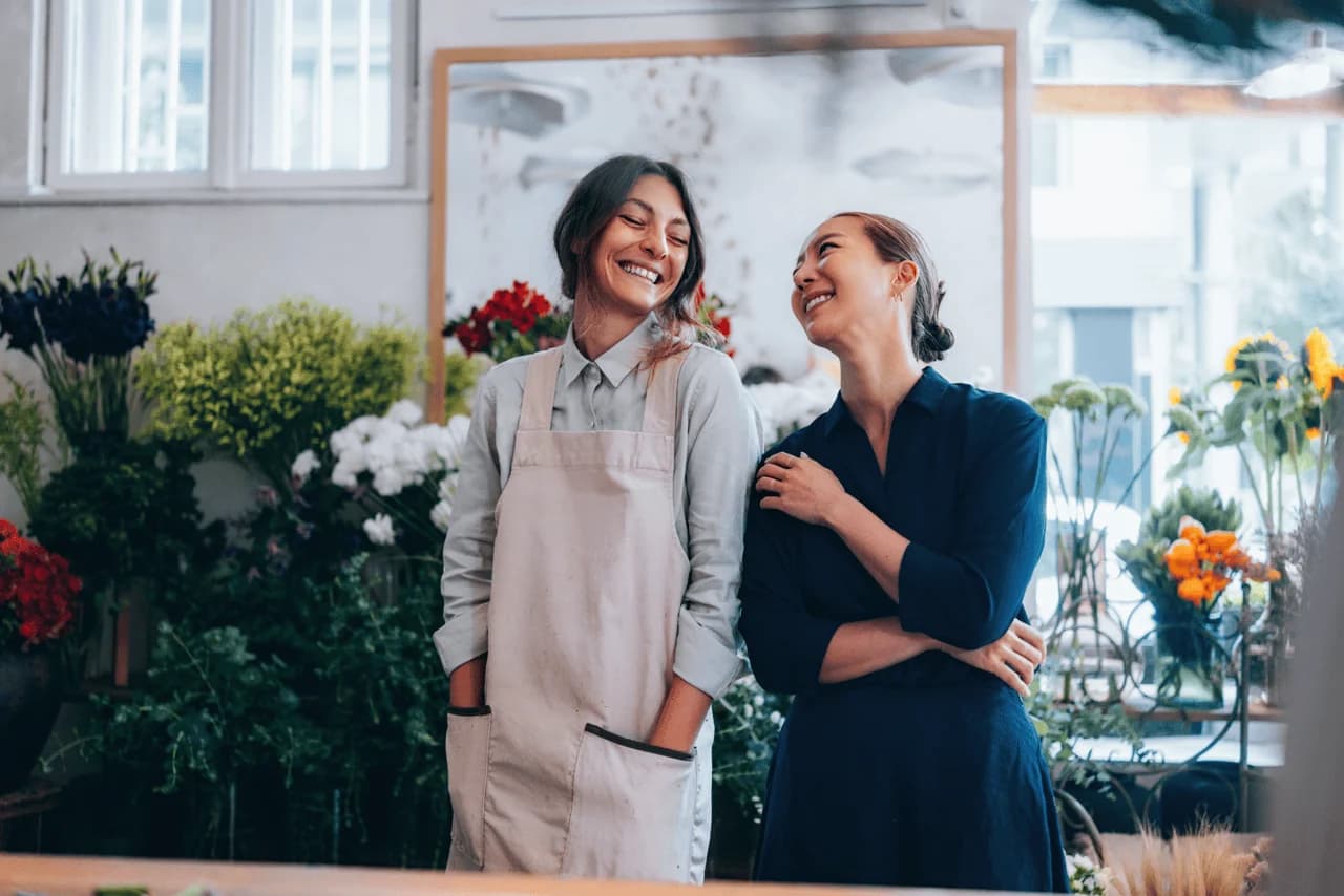A team helping a small business owner